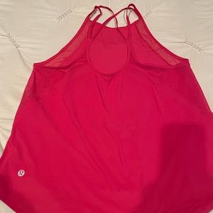 Pink lululemon workout tank with strappy details.